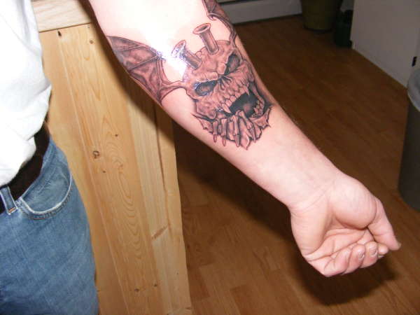 skull/wings/injection stacks tattoo