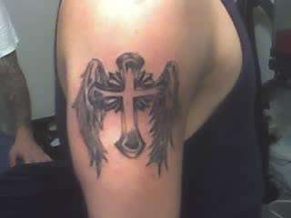 Cross with wings tattoo