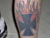 Flaming cross tattoo