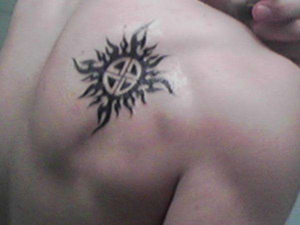 sun w/ lithuanian symbol tattoo