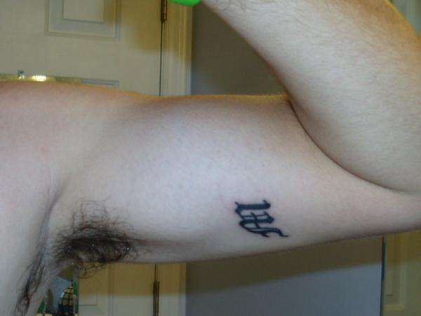'M' tattoo