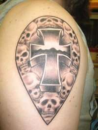 Cross w/ skulls tattoo