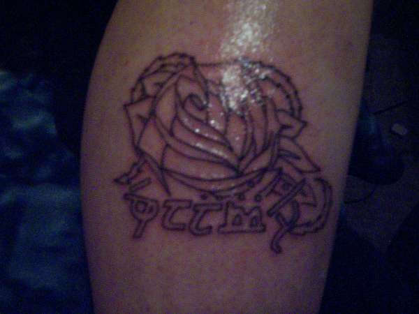 Flower  with Elfish writing tattoo