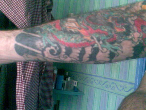 Lower arm, dragon, wind bars tattoo