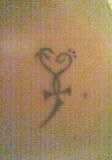 My First, Cross Heart tattoo