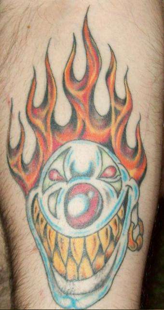 flaming hair clown tattoo