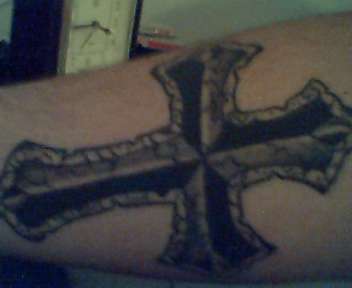 forearm cross tattoo