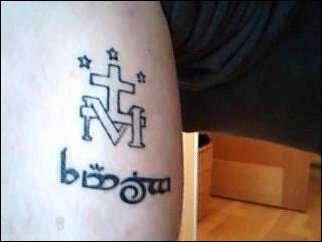miraculous medal with family in tengwar inside calf tattoo