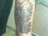 skull in smoke tattoo