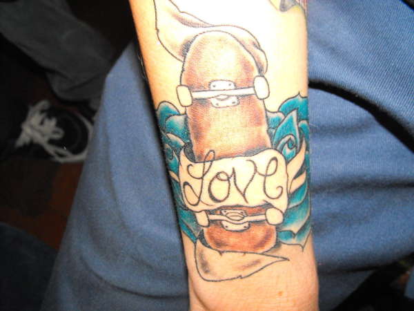 love skateboarding tattoo