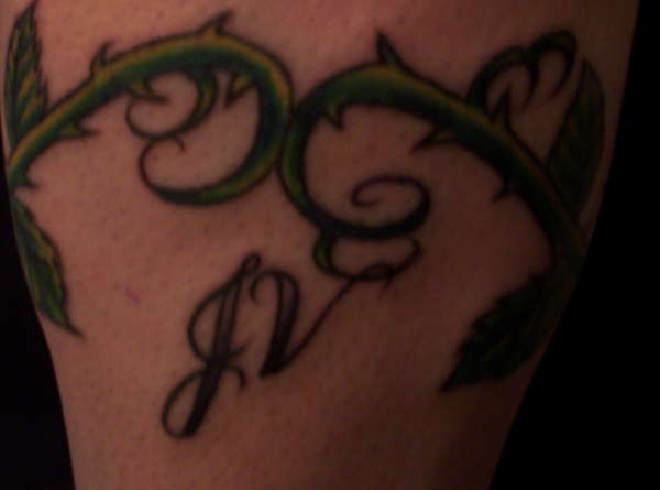 Stepson's initials, daughter's birth tattoo