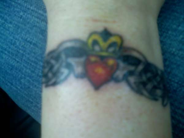 claudaugh wrist tattoo