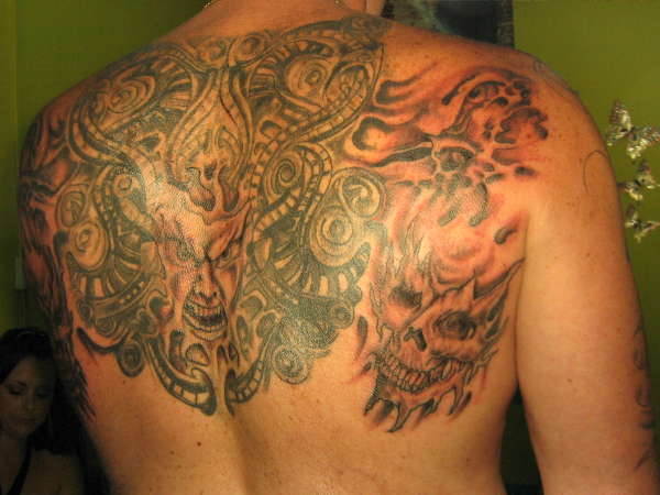 Upper back piece tattoo