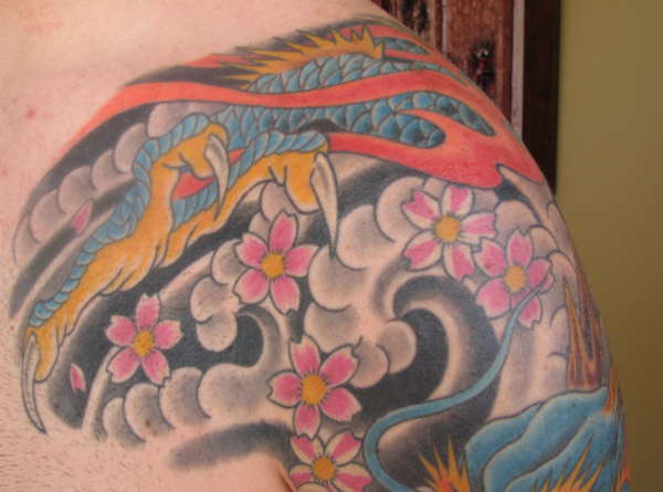 Chest and shoulder tattoo