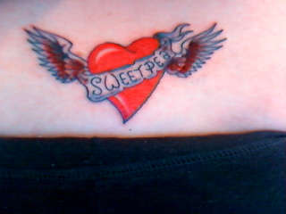 heart on lower back tattoo