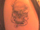 Smoking skull tattoo
