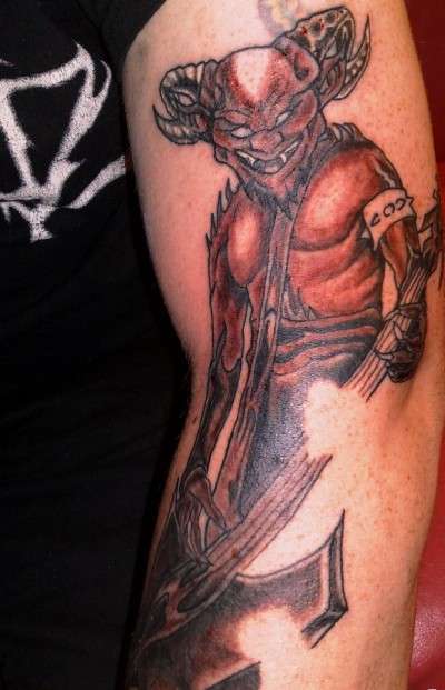 cover up. bass devil.....on th bass player in the band Thyruz tattoo