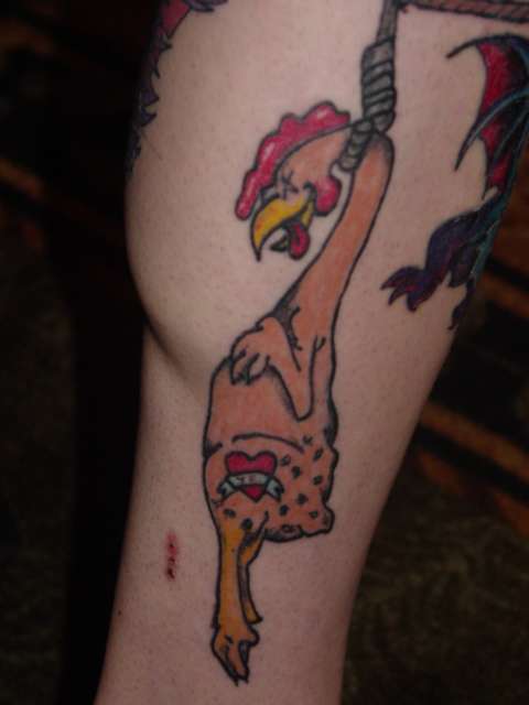 cock below knee tattoo