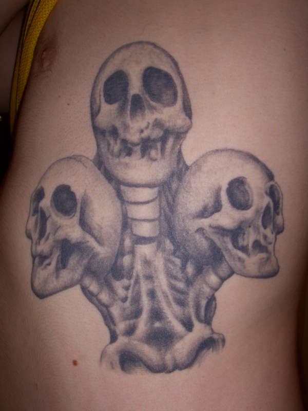 3 skulls of clubs tattoo