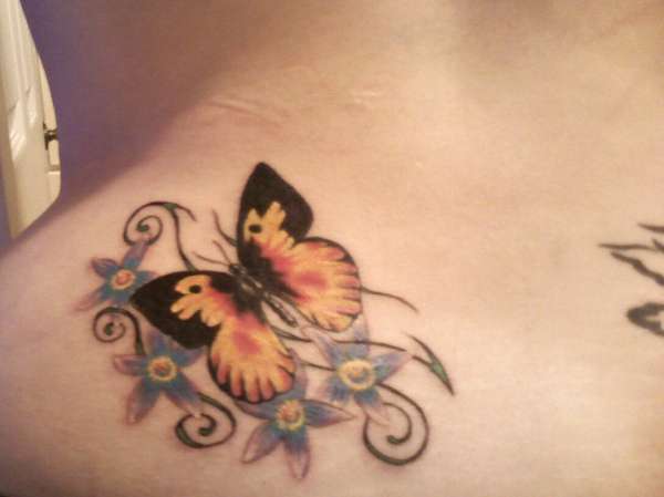 Butterfly over Blossoms tattoo