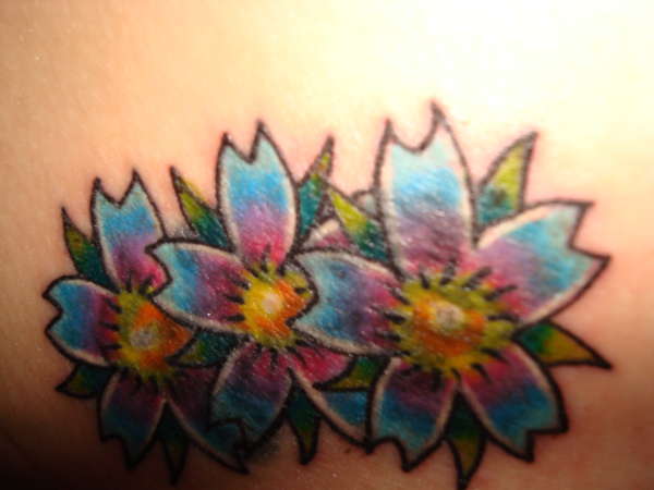 flower cover-up tattoo