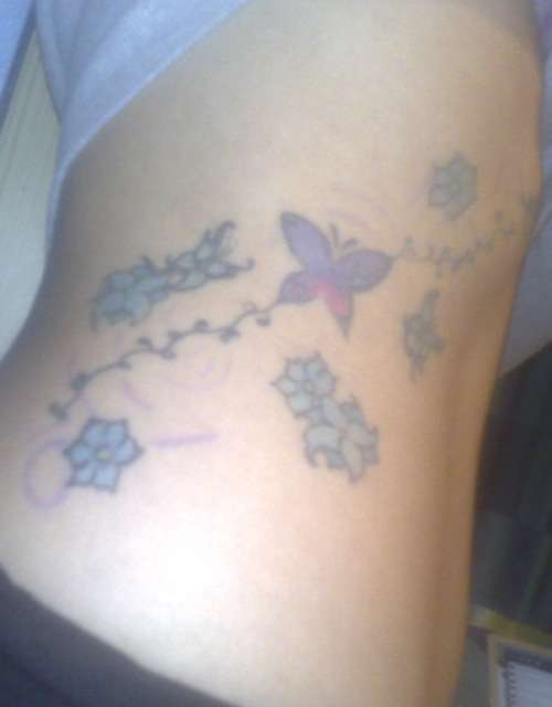 butterfly side tattoo