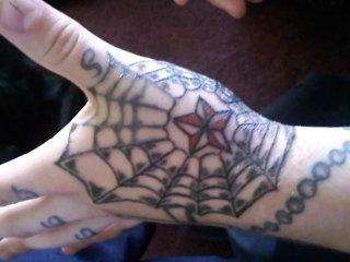 spider web on my hand tattoo