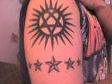 Heartagram with nautical stars tattoo