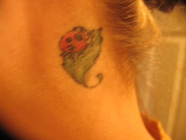 simba tattoo behind ear