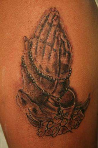 praying hands tattoo
