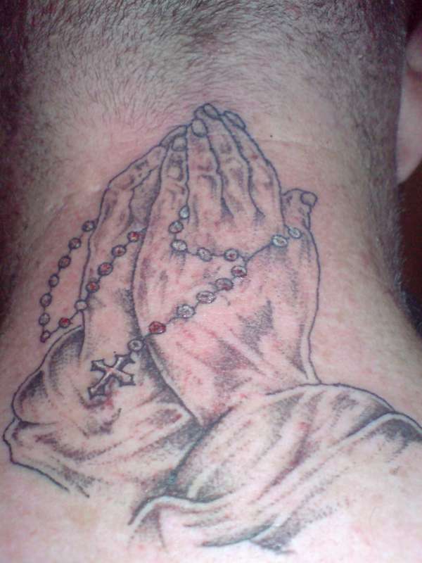 preying hands tattoo