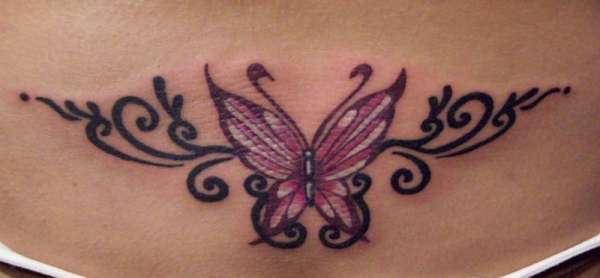 Butterfly tramp stamp tattoo