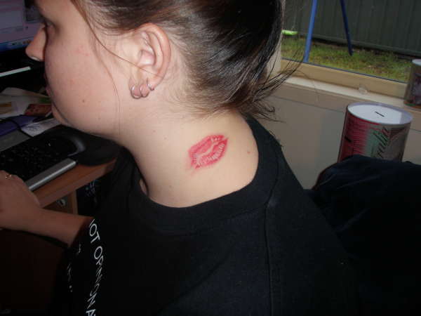 Kiss on the neck tattoo