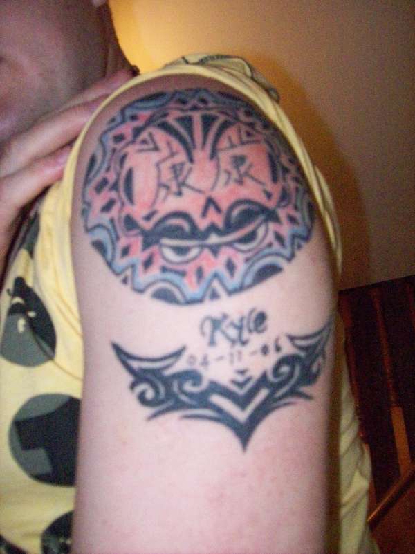 tribal with my sones name and dob tattoo