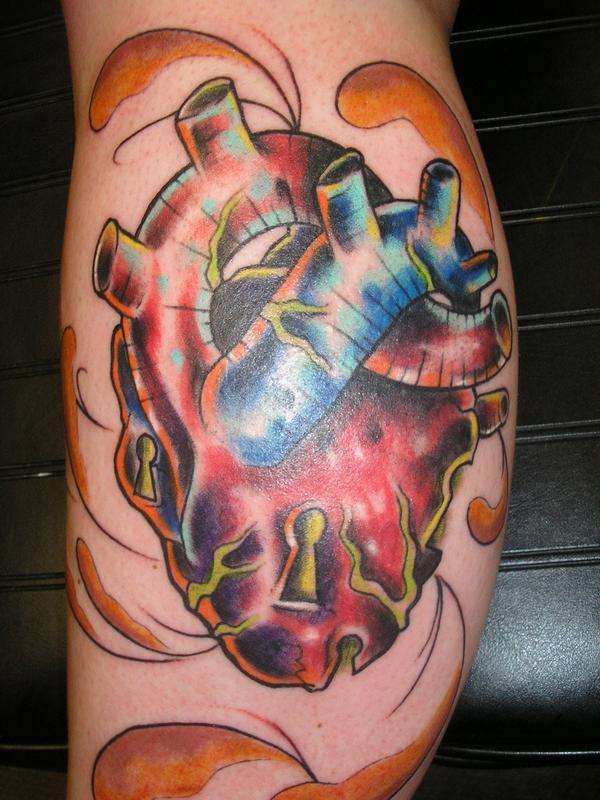 anatomical heart left leg tattoo