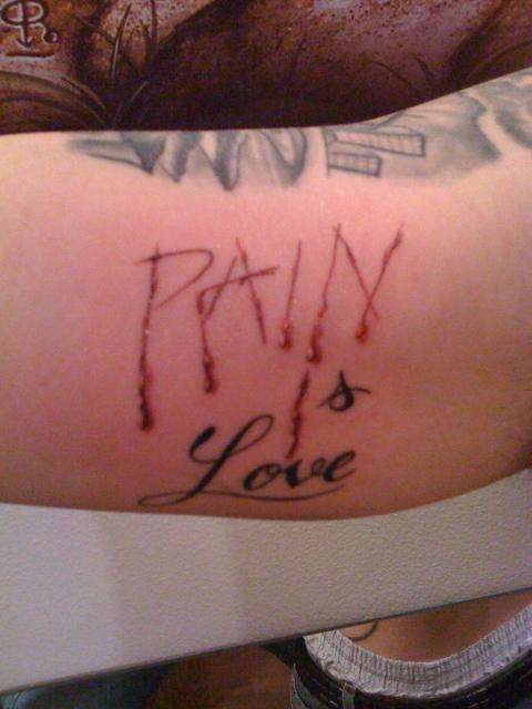 Pain is Love tattoo