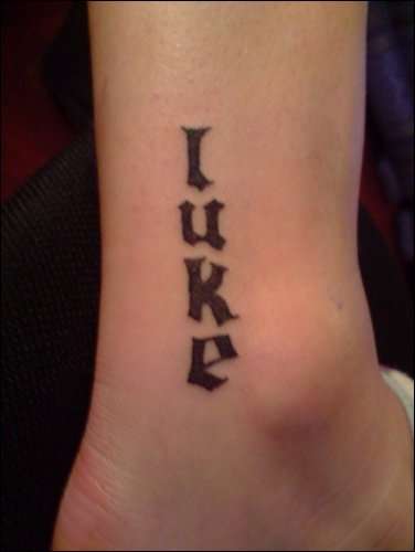 Small lettering on ankle tattoo