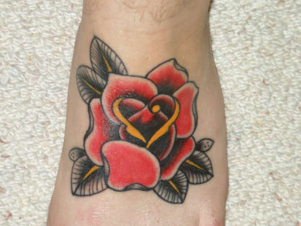 Rose on Left foot tattoo