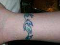 Dolphin ankle tat tattoo