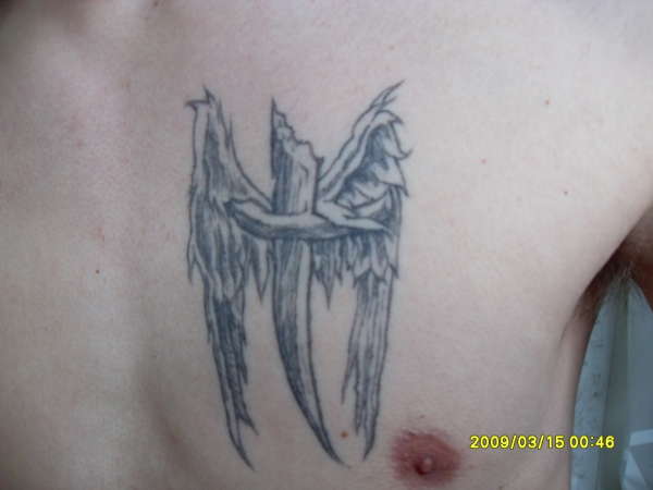 Cross with wings tattoo