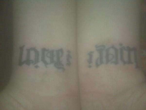 Love is Pain Ambigram 1 tattoo