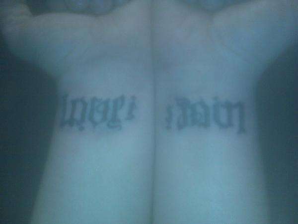 Love is Pain Ambigram 2 tattoo