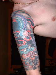 Half Sleeve with a small coverup tattoo
