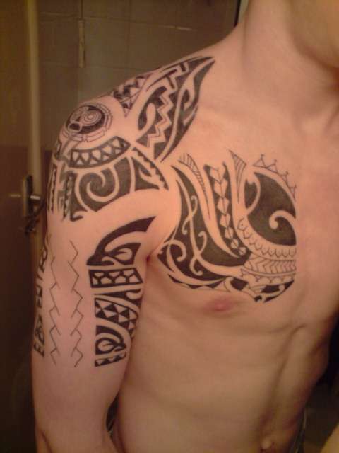 Polynesian half sleeve and chest tattoo