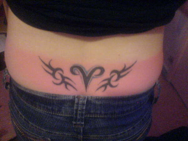 ma star sign wiv a tribal each side tattoo