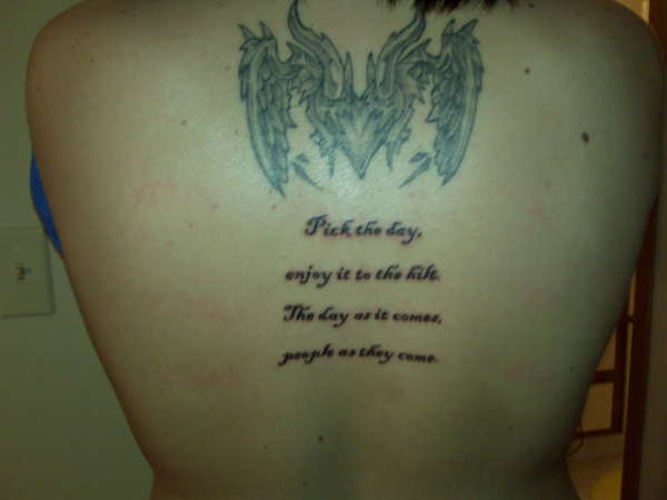 My two tattoos on my upper back tattoo