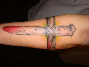 Nail cross tattoo