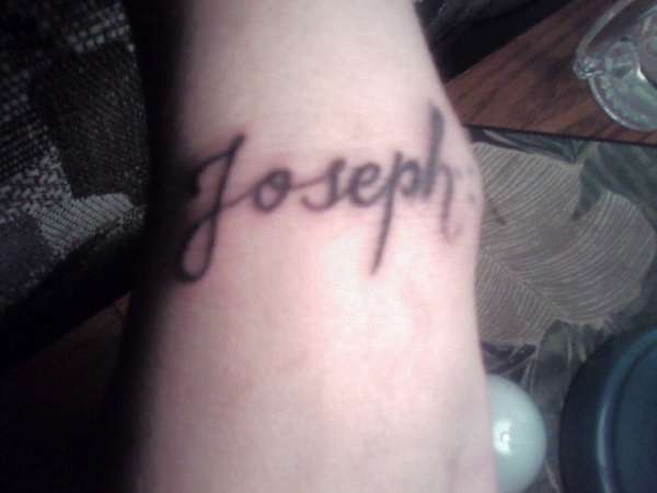 Name on wrist tattoo