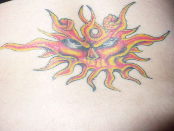 angry sun tattoo