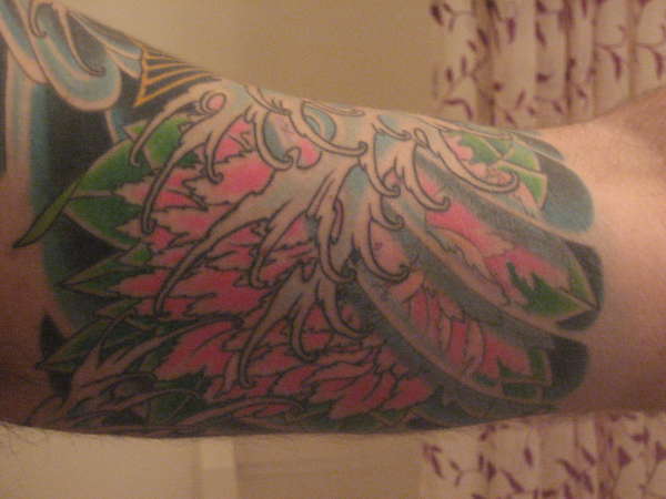 Flowers with koi tattoo